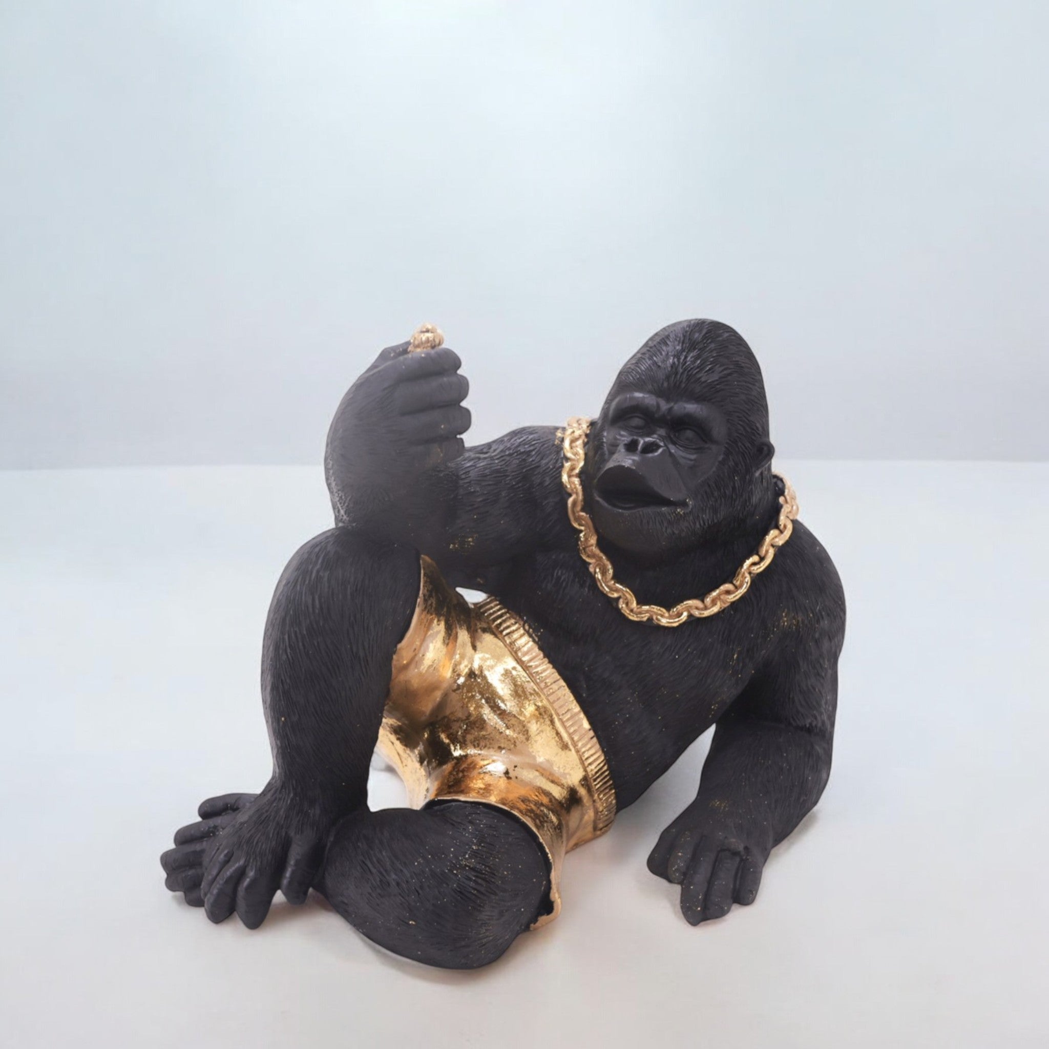 Modern Lounging Gorilla Sculpture | Black & Gold Urban Art Statue | 28.5cm Contemporary Home Decor - Divine Dekor