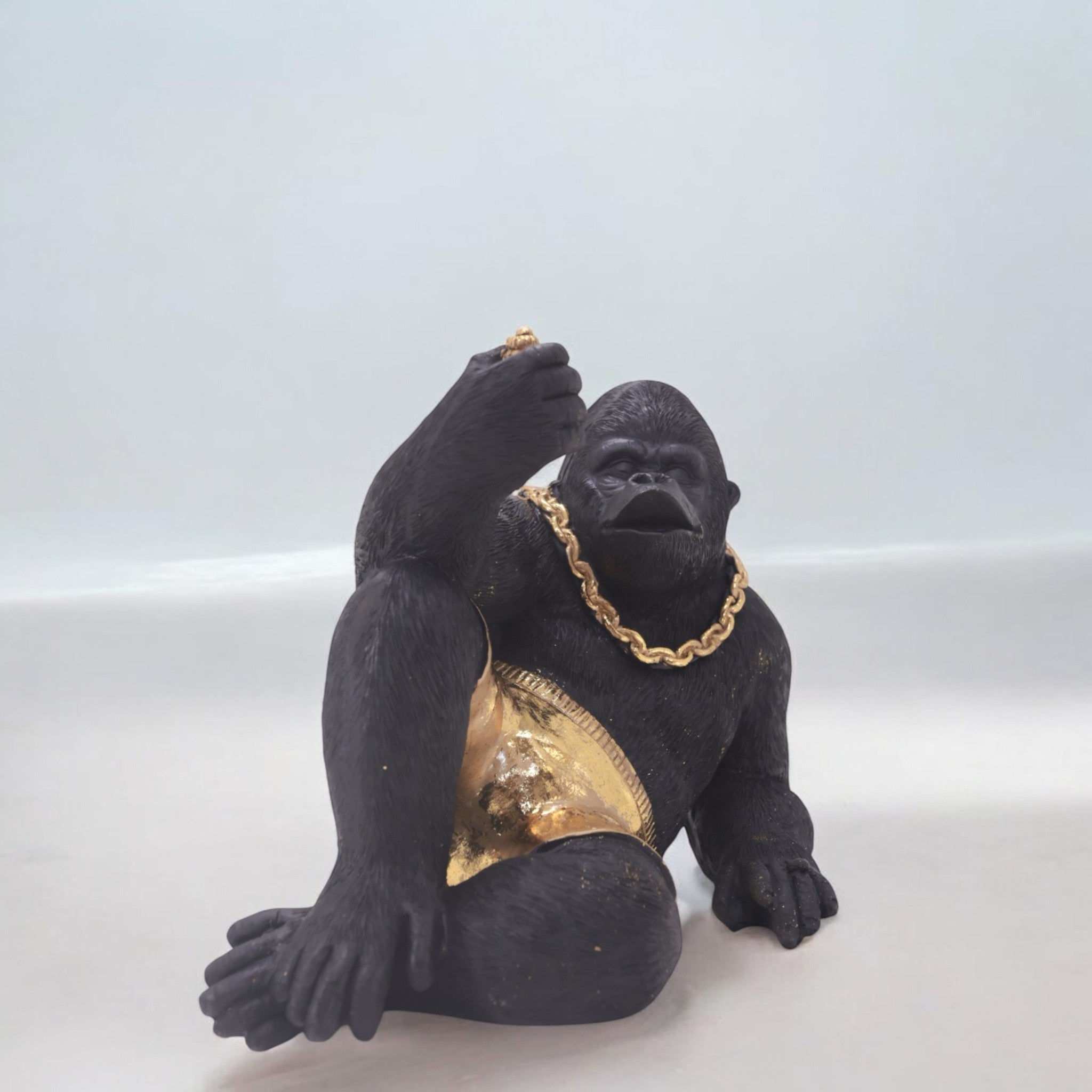 Modern Lounging Gorilla Sculpture | Black & Gold Urban Art Statue | 28.5cm Contemporary Home Decor - Divine Dekor